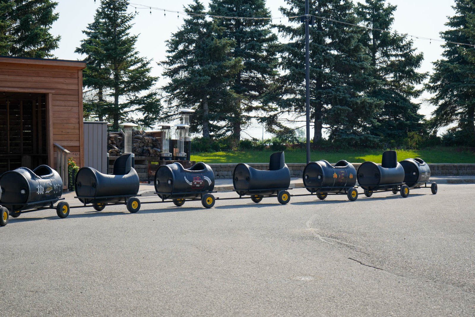 Kids enjoying a barrel train at a fair