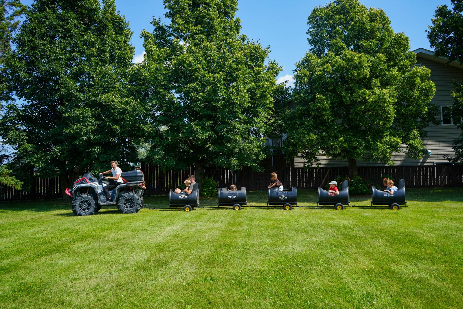 Children enjoying a barrel train ride